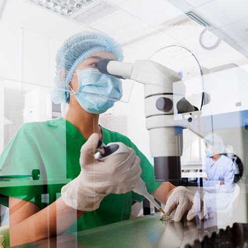 Stem Cell & Biologic Therapies - Lab technician looking at samples